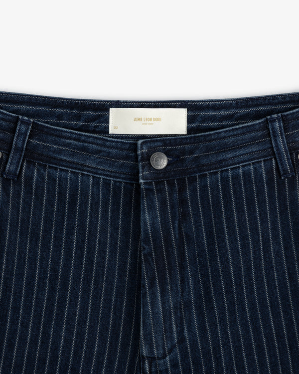 Close-up of the waist and fly of Chalk Stripe Painter Pant with a metal button and belt loops.