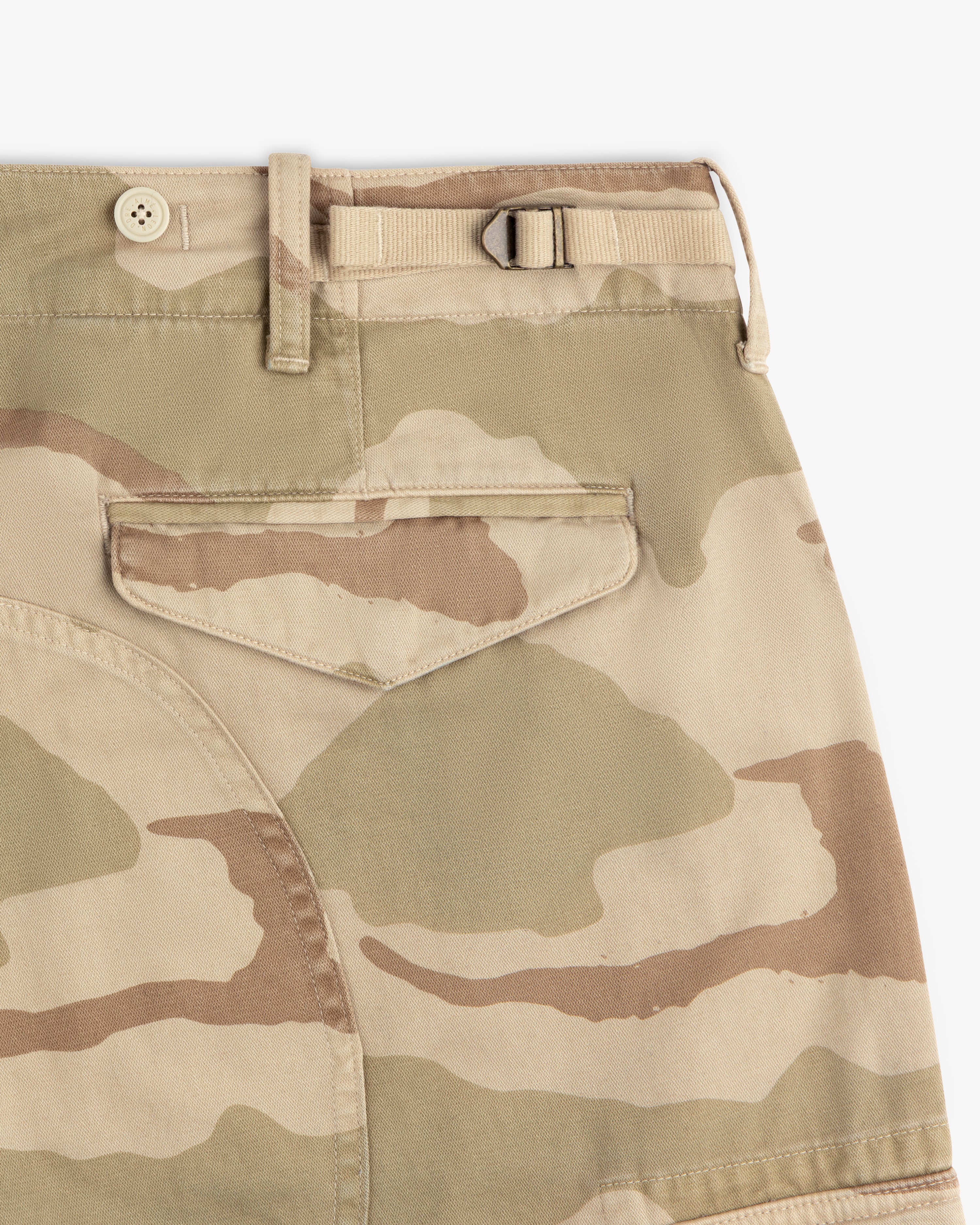 Camo Fatigue Pant in tan featuring a rear flap pocket, a button closure, and a side adjustment strap at the waistband.