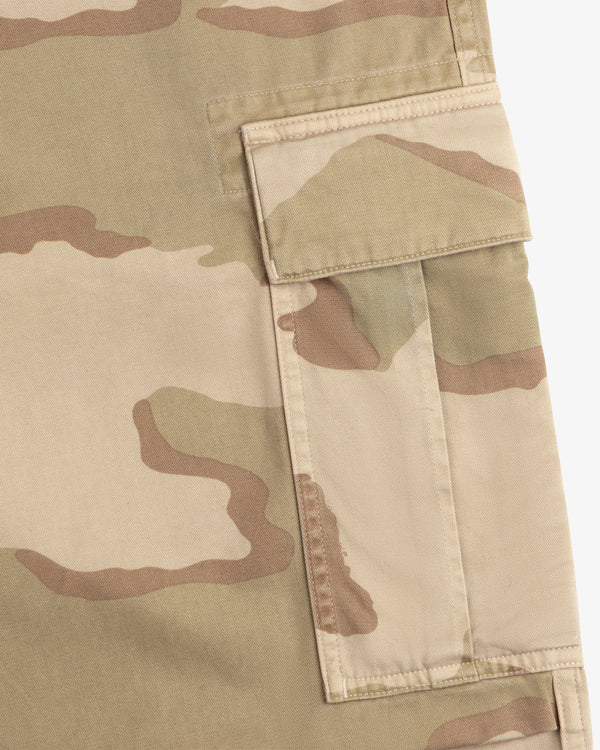 Close-up of a tan and olive Camo Fatigue Pant cargo pocket with a flap.