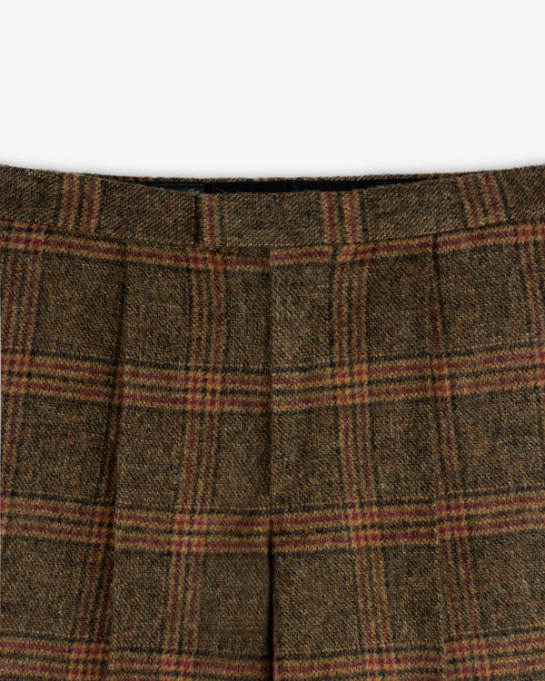 Plaid Tweed Suit Trouser in brown tweed with a dark plaid pattern, red accents, and a pleated waistband.