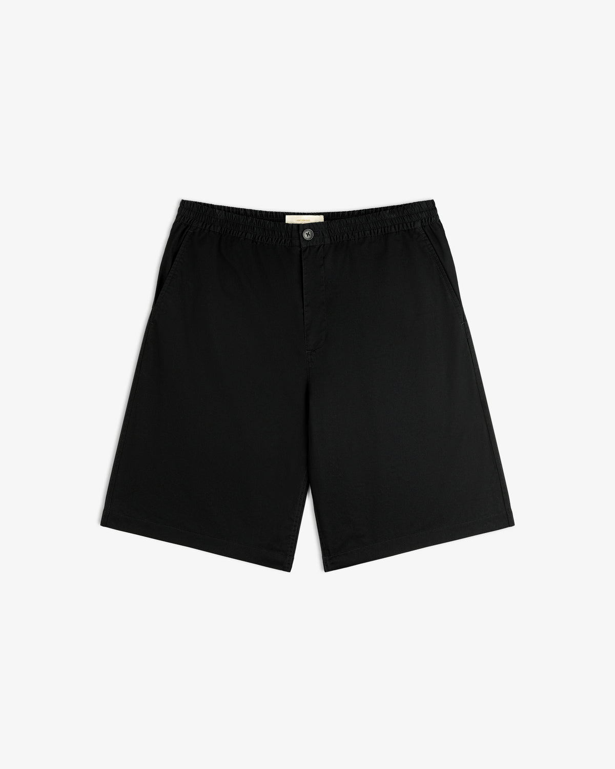 Cotton Casual Short: black, knee-length, elastic waistband, side pockets, button closure, laid flat on white.