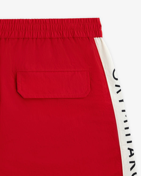Red ALD / Olympiacos F.C. Nylon Training Short with an elastic waistband, back pocket, and white side stripe with text.
