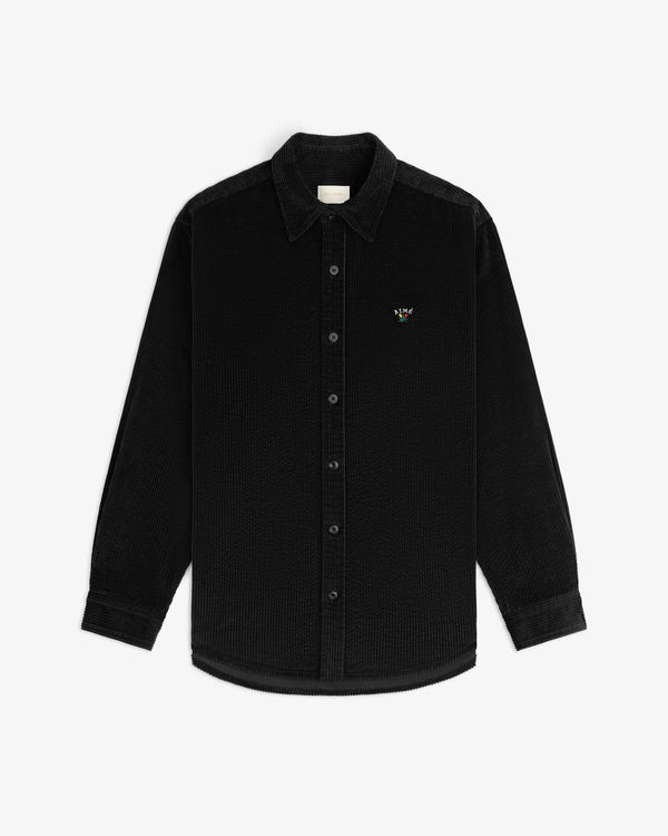 Black Corduroy Leon Overshirt, a long-sleeve button-up with a small embroidered logo on the chest.