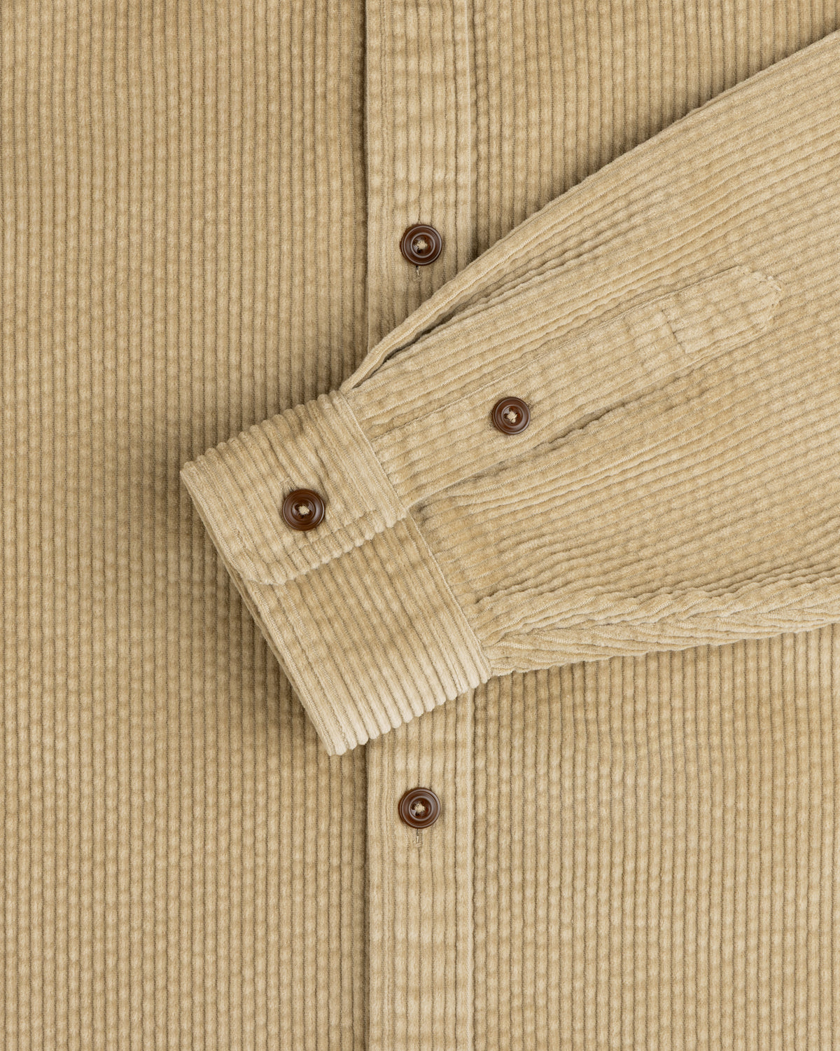 Corduroy Leon Overshirt in tan with brown buttons and a buttoned cuff.