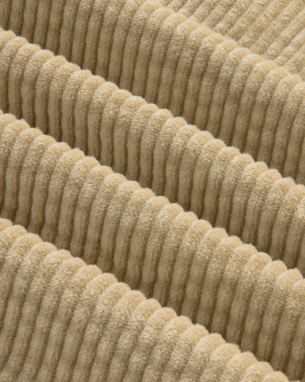 Close-up of the beige Corduroy Leon Overshirt, featuring wide, raised vertical wales in the fabric.