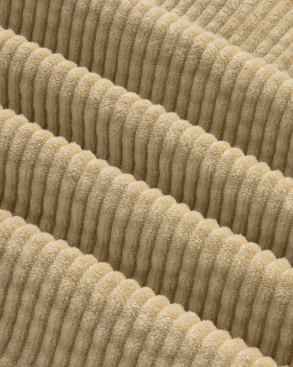 Close-up of the beige Corduroy Leon Overshirt, featuring wide, raised vertical wales in the fabric.