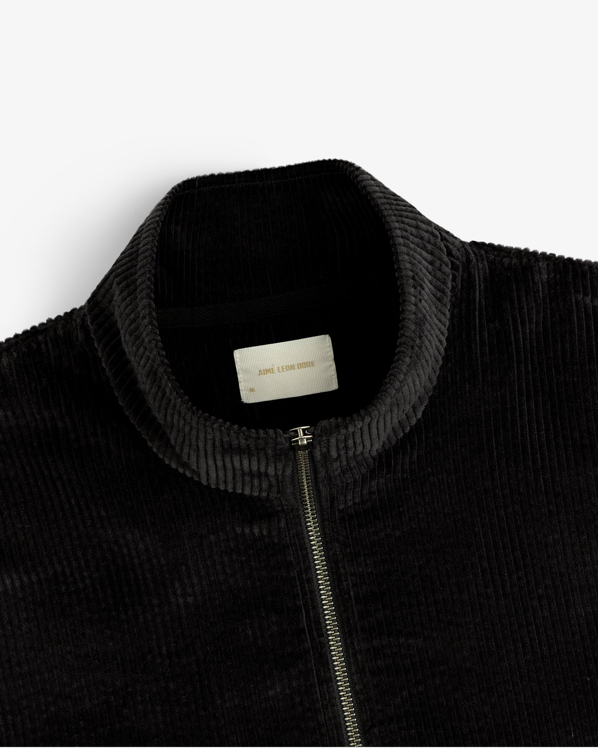 Black Quarter Zip Corduroy Shirt with a high neck and silver metal zipper.