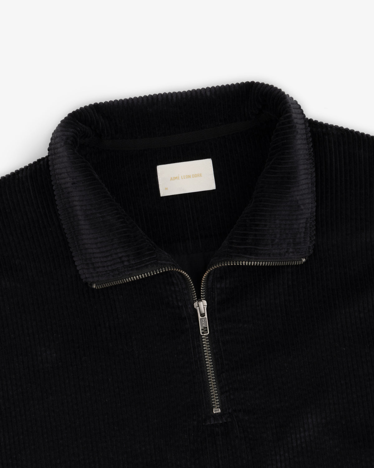 Black Quarter Zip Corduroy Shirt with a silver zipper and collared neckline.