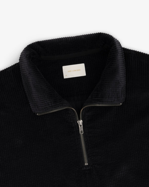 Black Quarter Zip Corduroy Shirt with a silver zipper and collared neckline.