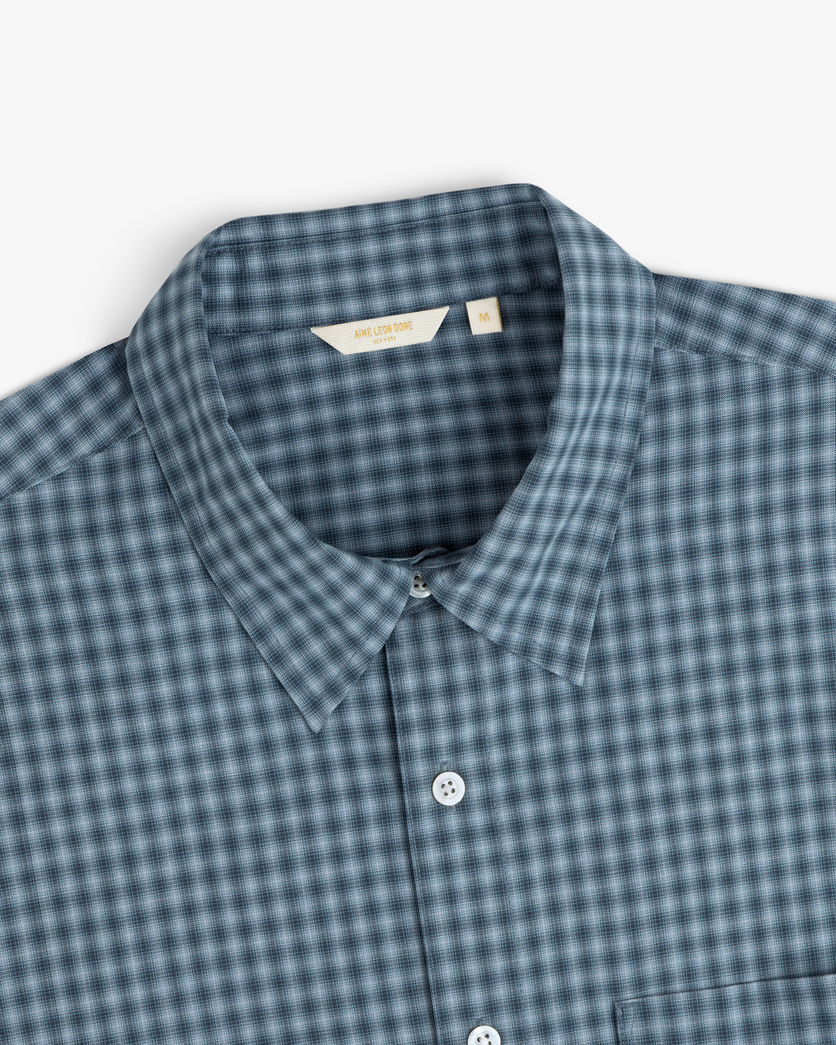 Plaid Casual Shirt in blue and gray with white buttons, collared, size M label visible.