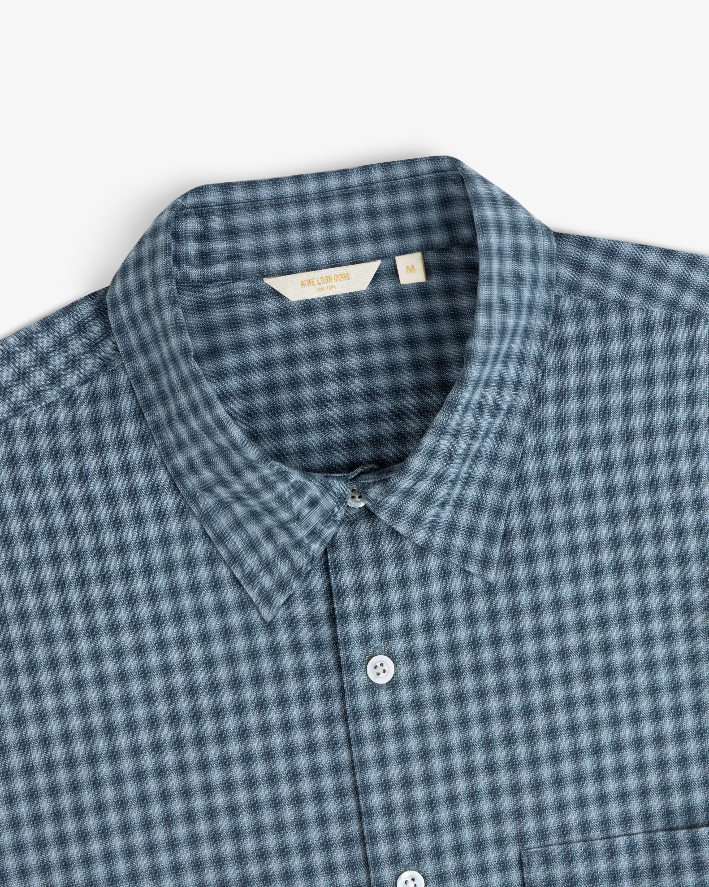Plaid Casual Shirt in blue and gray with white buttons, collared, size M label visible.