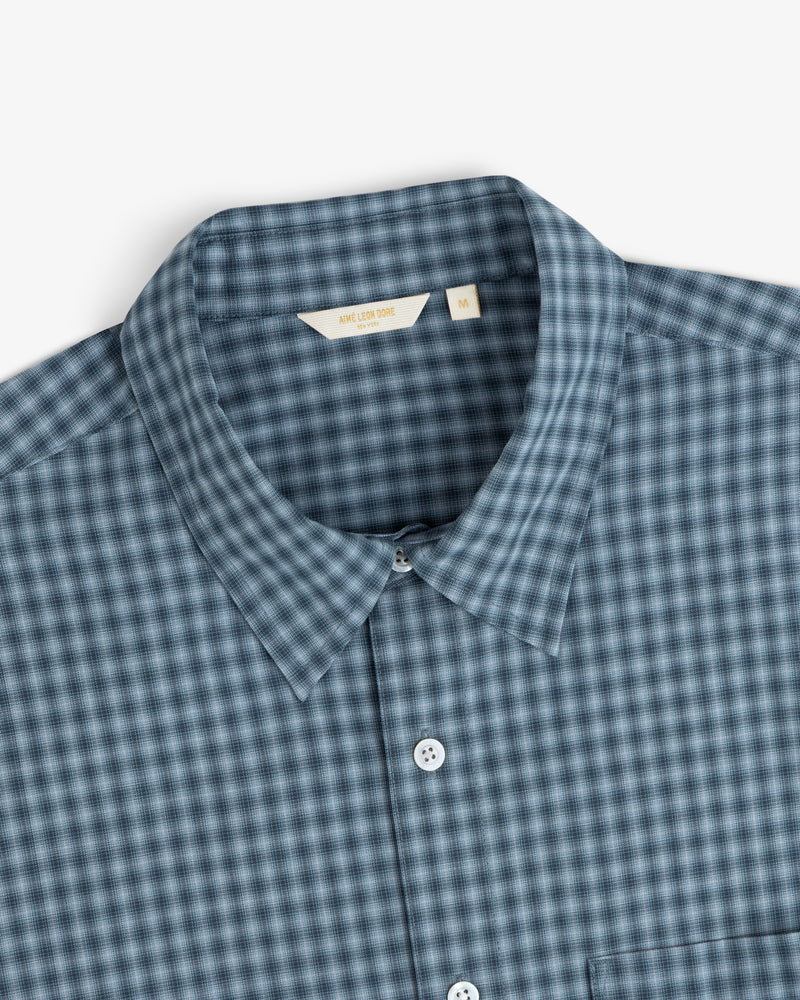 Plaid Casual Shirt in blue and gray with white buttons, collared, size M label visible.