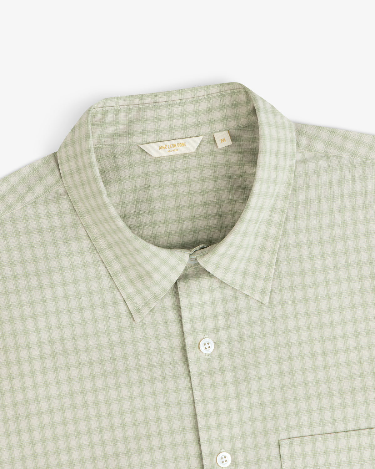 Plaid Casual Shirt in light green with collar, pocket, and white buttons, shown from top front angle.