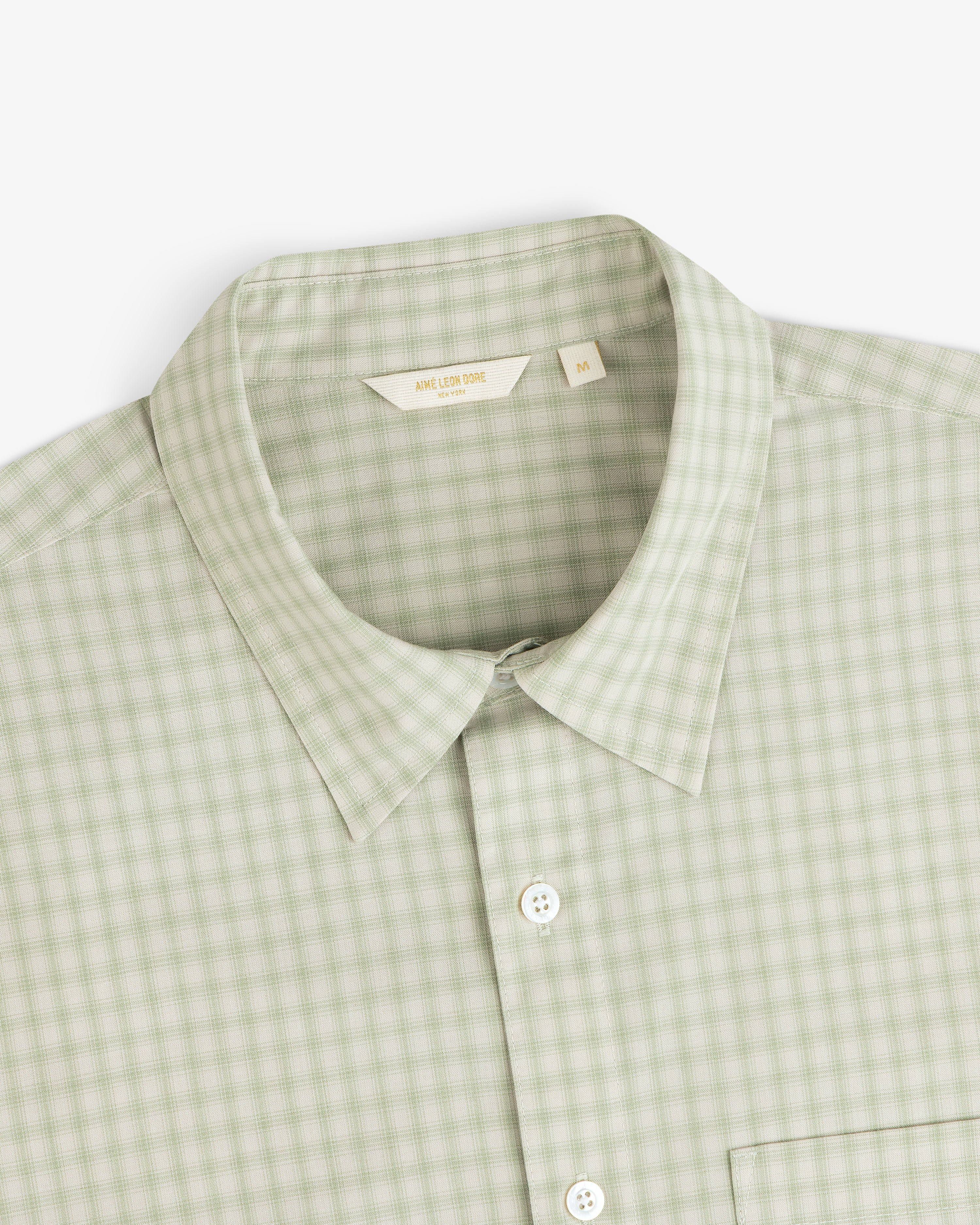 Plaid Casual Shirt in light green with collar, pocket, and white buttons, shown from top front angle.