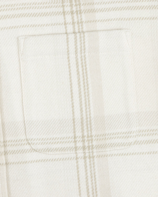 Close-up of a chest pocket on a cream and tan Yarn Dyed Plaid Overshirt.