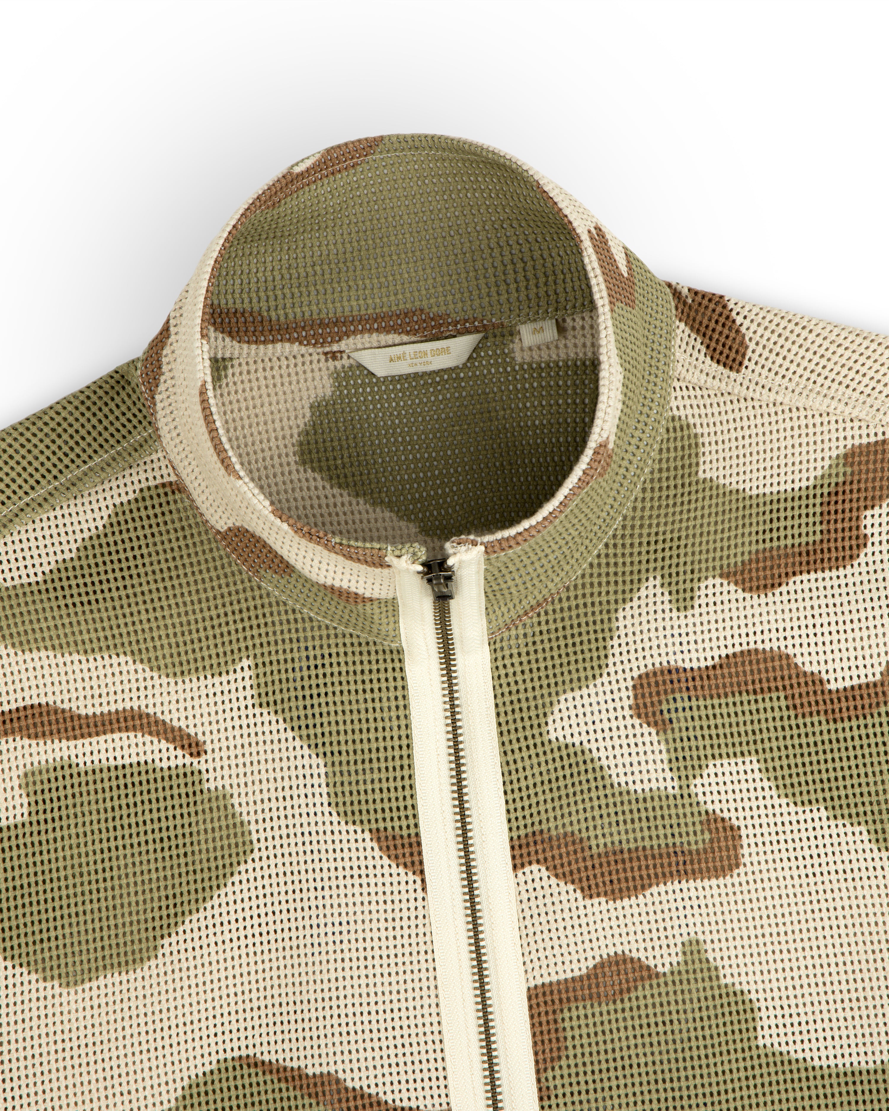 Camo Mesh Zip Overshirt featuring a camouflage mesh pattern, mock neck, front zipper, and size M label.