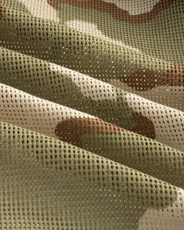 Close-up of gathered mesh fabric in a green, tan, and brown camouflage pattern on the Camo Mesh Zip Overshirt.