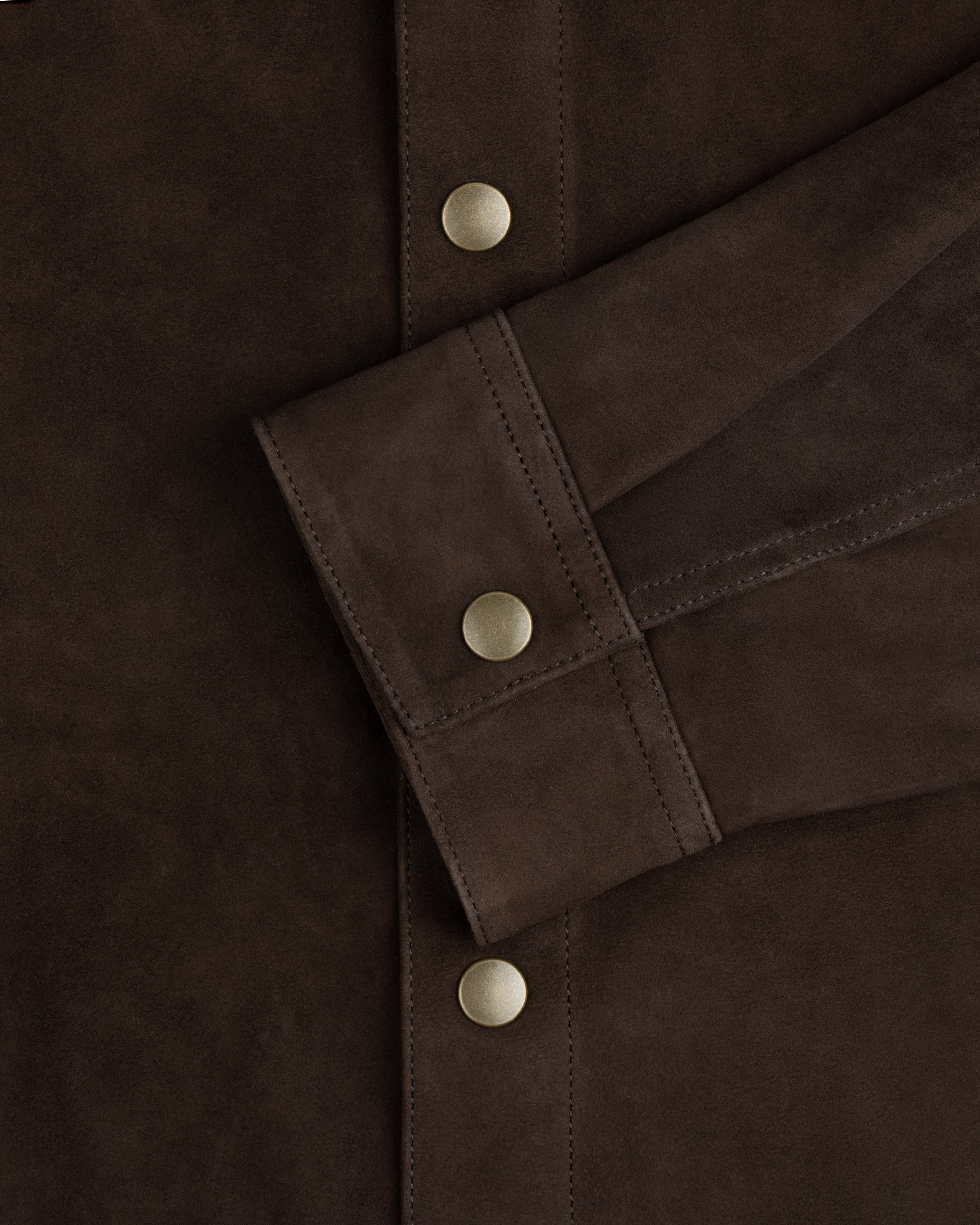 Dark brown suede Suede Overshirt cuff with a matte gold button, matching those on the placket.