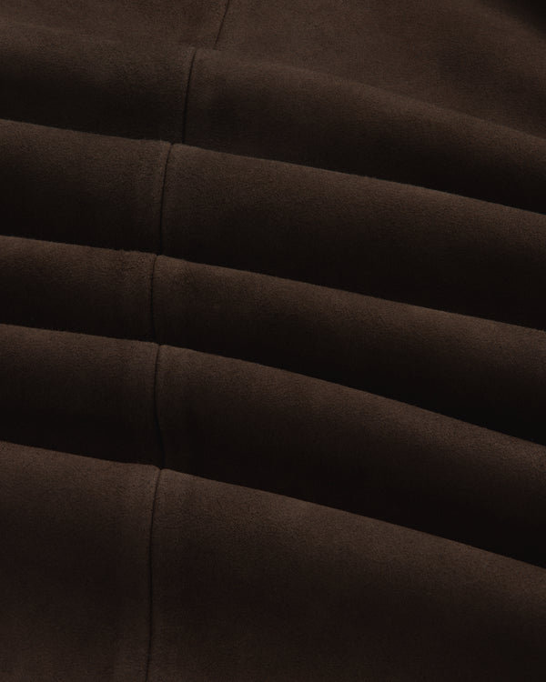 Close-up of the dark brown suede Suede Overshirt featuring horizontal seamed folds.