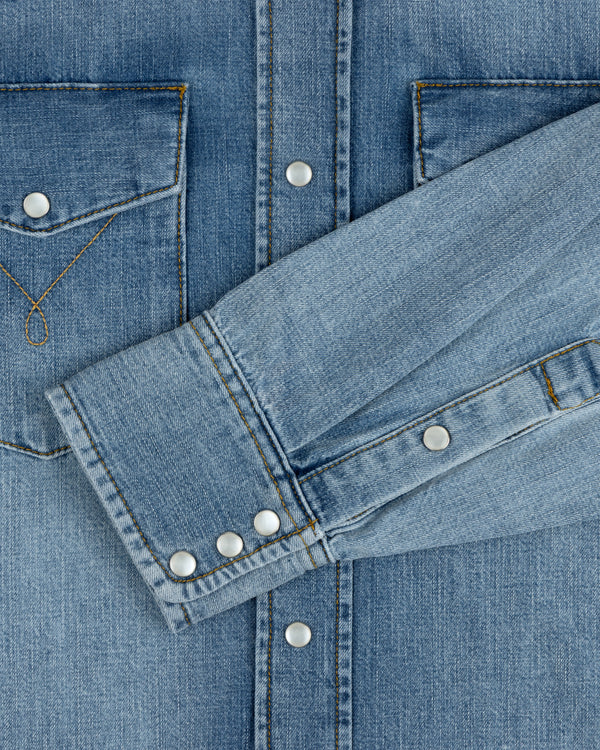Denim Western Shirt in blue with silver snap buttons, chest pockets, and buttoned cuffs.