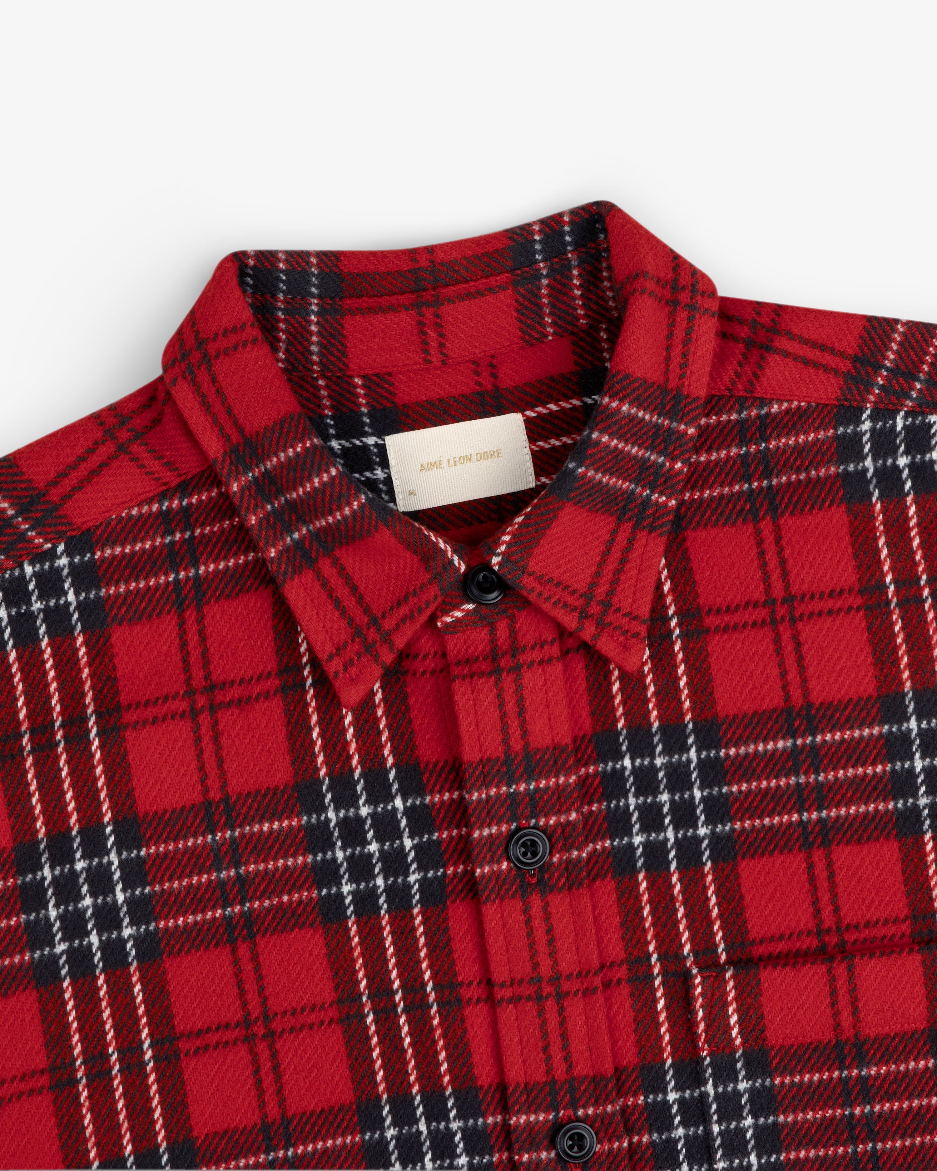 Yarn Dyed Plaid Overshirt in red and black with long sleeves and buttons.