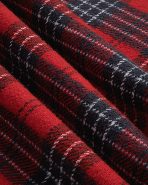 Close-up of a Yarn Dyed Plaid Overshirt featuring a red, black, and white plaid pattern with deep folds.