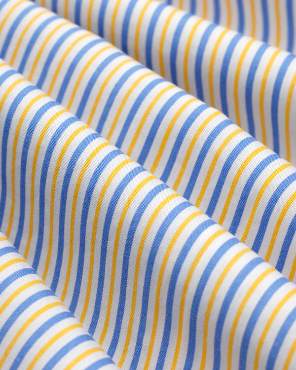 Close-up of a Striped Button Down Poplin Shirt in white fabric with thin vertical blue and yellow stripes.