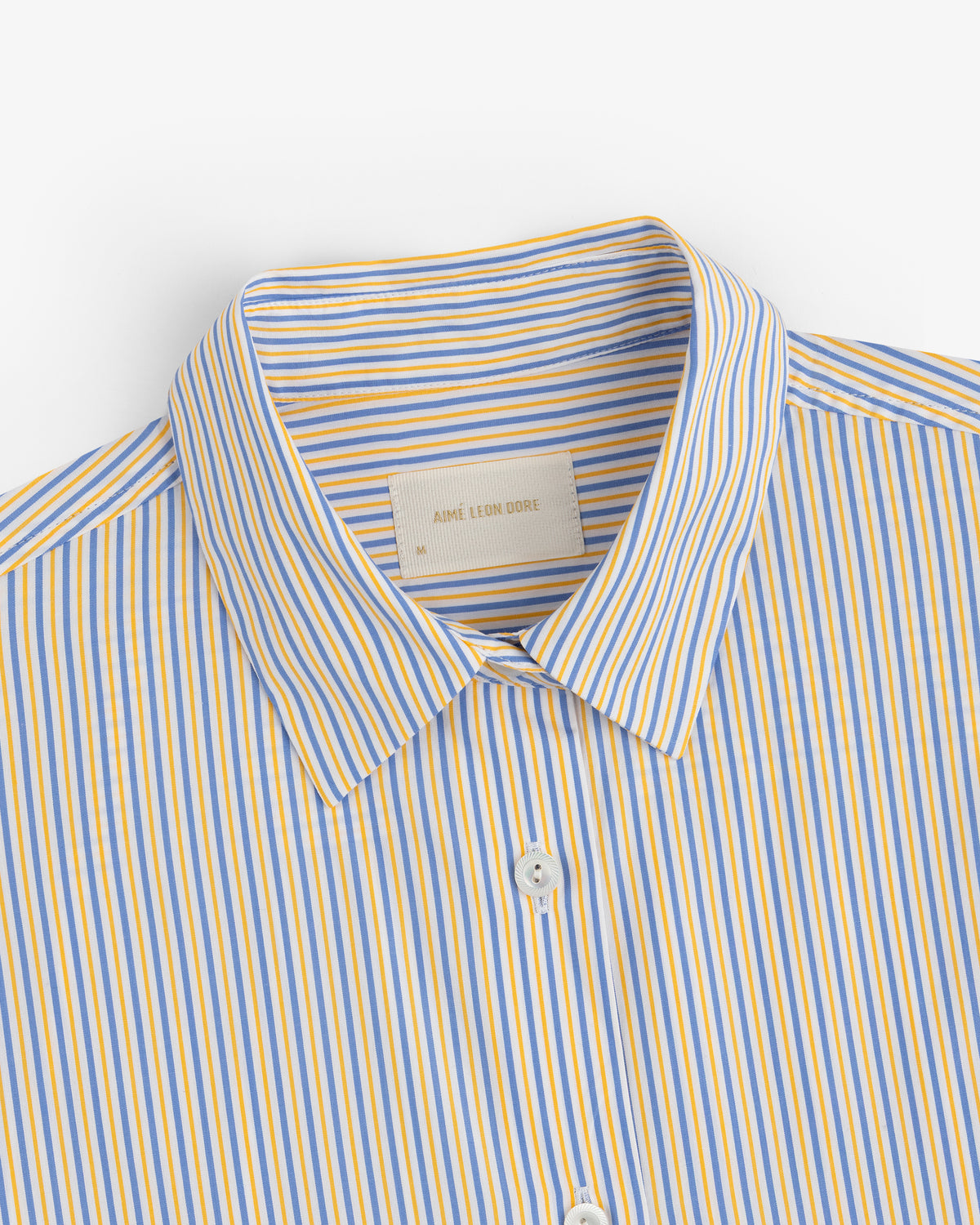 Striped Button Down Poplin Shirt with vertical blue and yellow stripes.