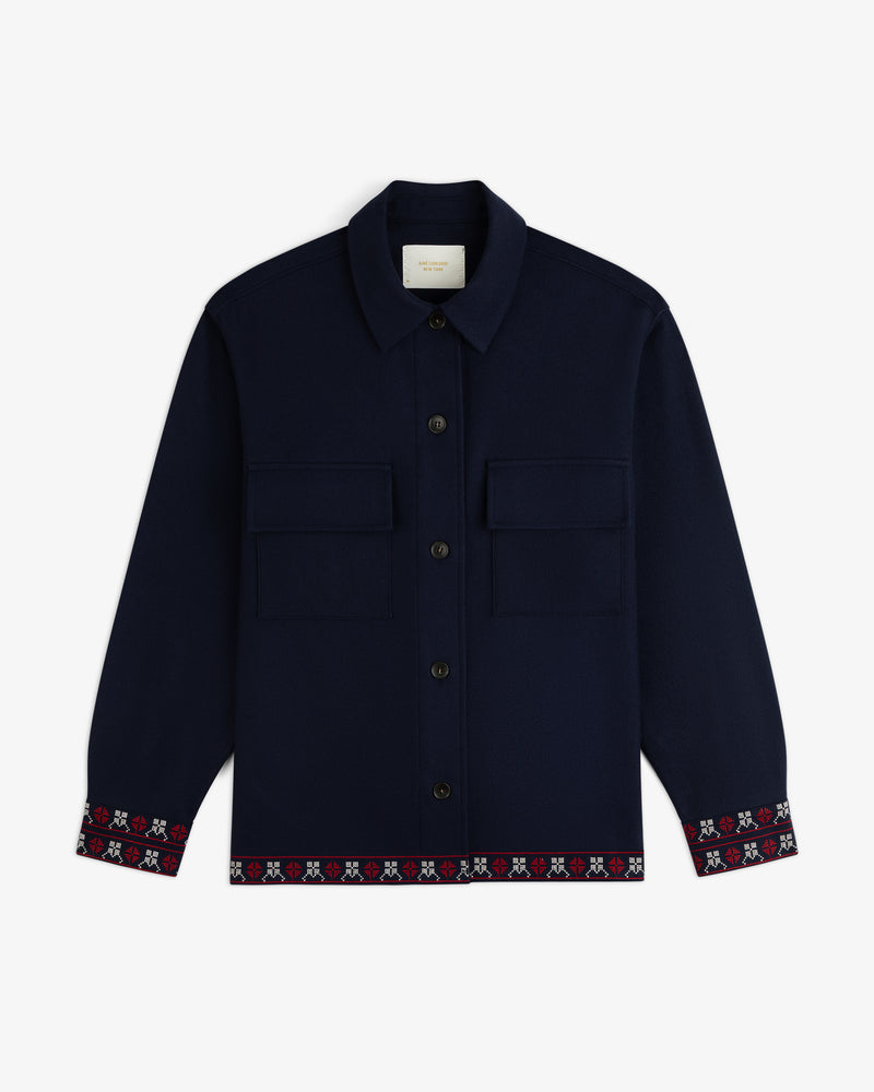 Mani Embroidered Wool Jacket in navy blue with button-down front, chest pockets, and patterned cuffs and hem.