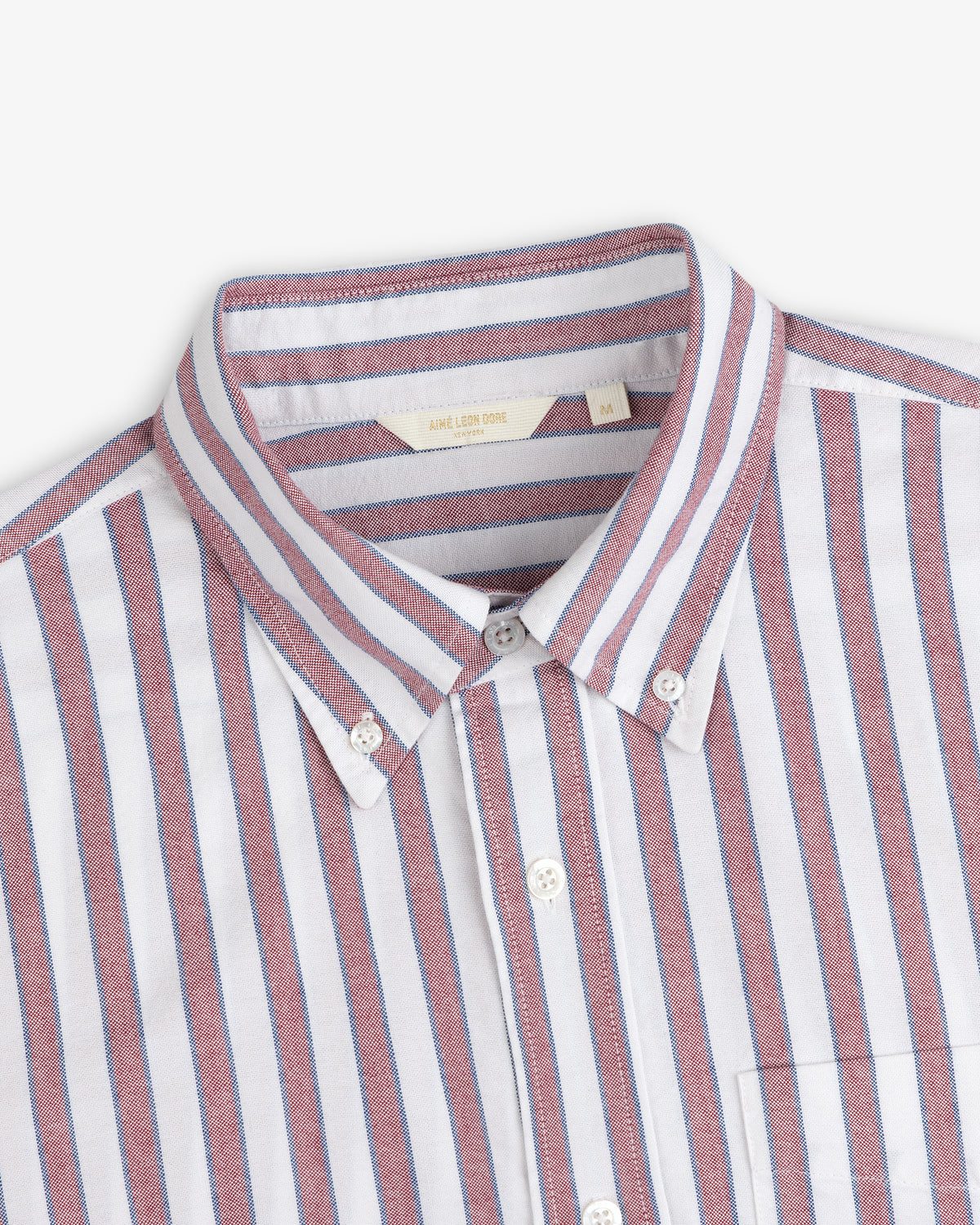 Striped Crest Oxford Shirt: White, button-down with red & blue vertical stripes, collar, and chest pocket.