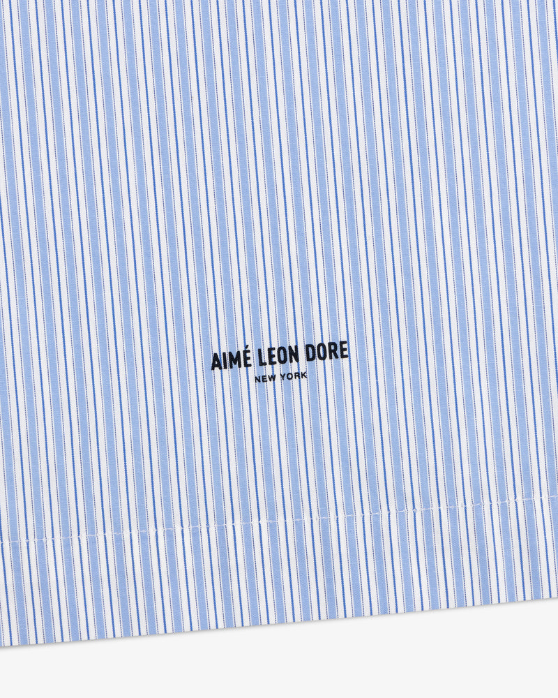 Poplin Casual Shirt in light blue and white stripes with AIMÉ LEON DORE NEW YORK logo printed in black.