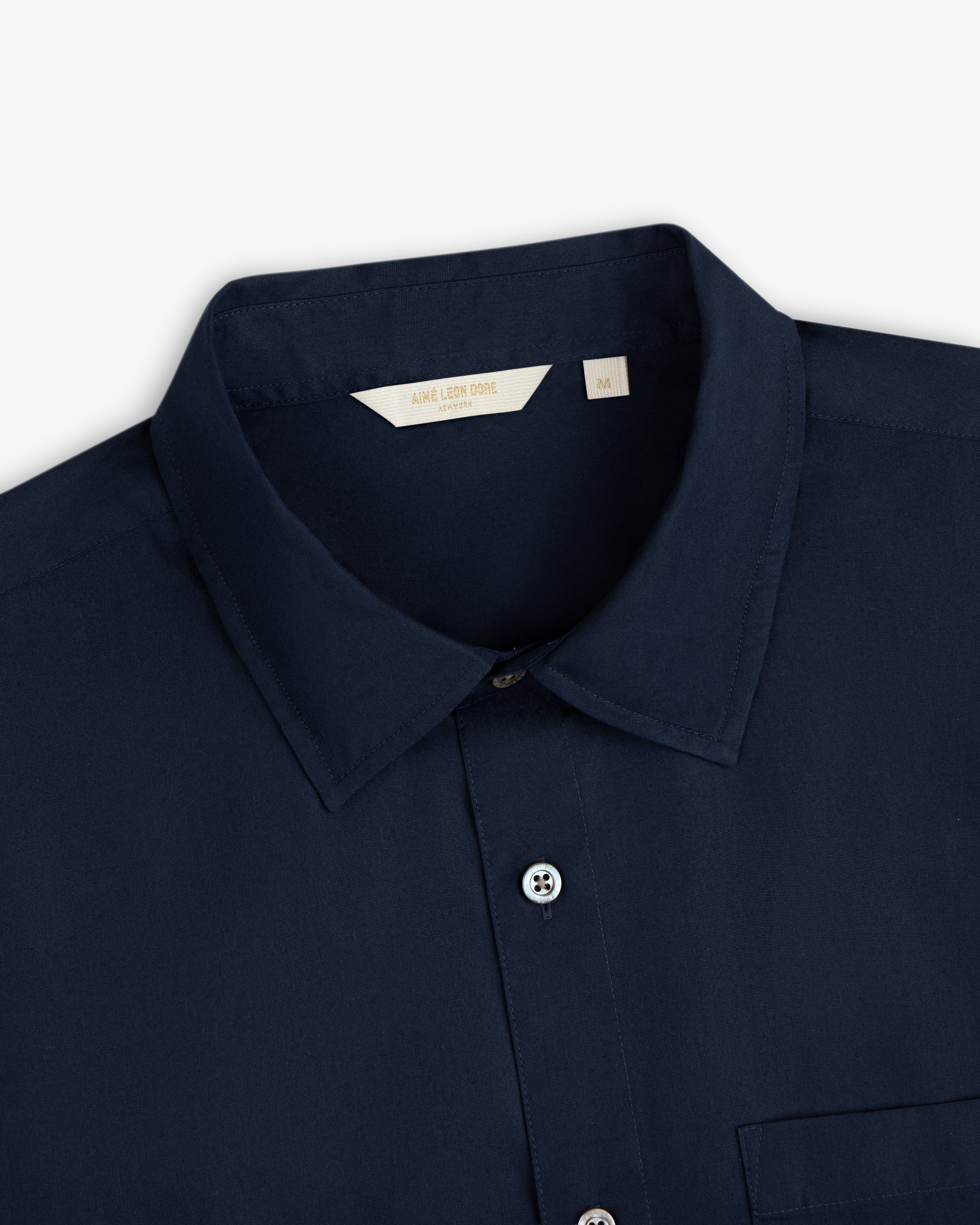 Navy blue Poplin Casual Shirt, collared button-up, size medium tag visible inside the collar.