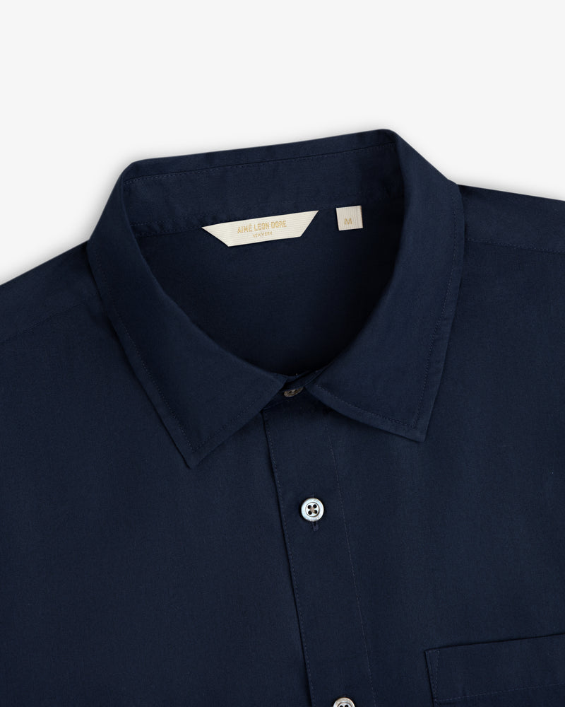 Navy blue Poplin Casual Shirt, collared button-up, size medium tag visible inside the collar.