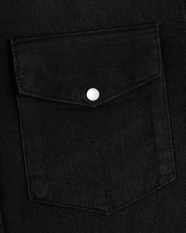Denim Western Shirt pocket in black denim with a pointed flap and a single silver snap button.