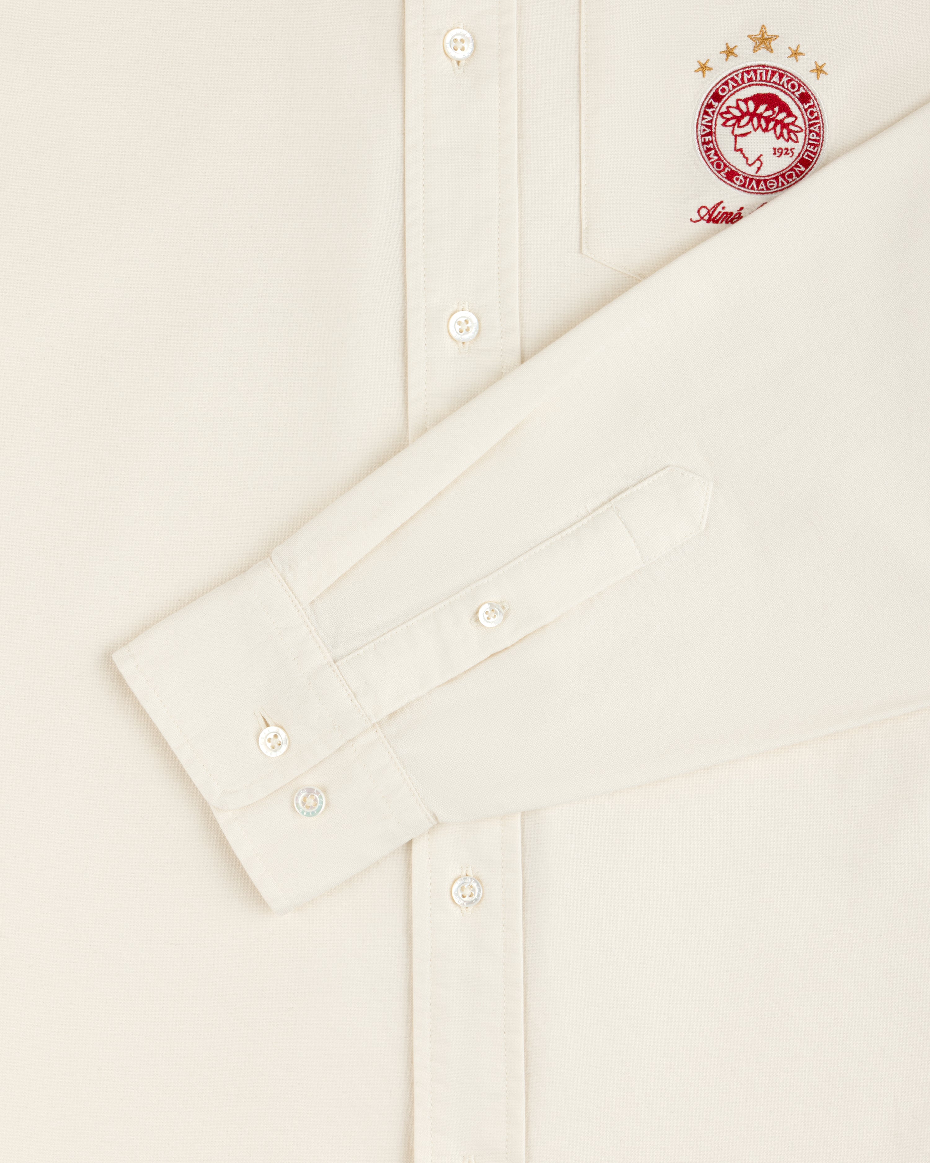 Off-white long-sleeve ALD / Olympiacos F.C. Logo Oxford Shirt with an embroidered club crest on the chest pocket.
