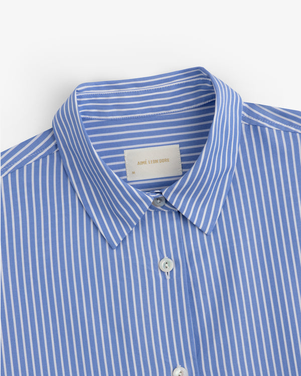 Striped Button Down Poplin Shirt in a blue and white vertical striped pattern with a collar.