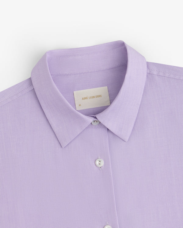 Close-up of a light purple Button Down Poplin Shirt with a collar and buttons.