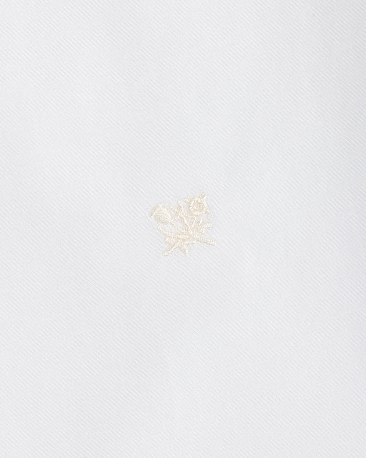 White Button Down Poplin Shirt in fabric featuring a small, tonal embroidered floral design.