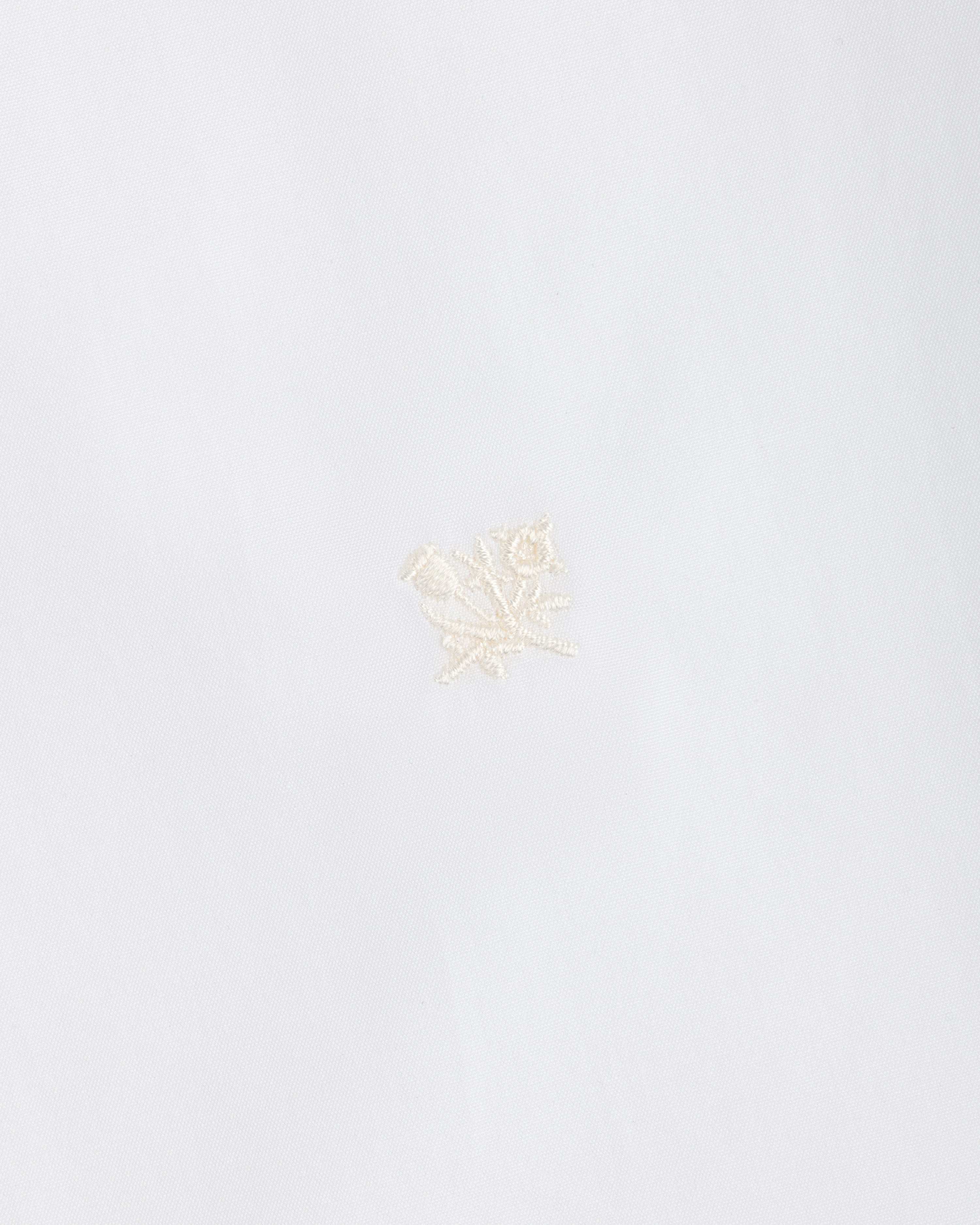 White Button Down Poplin Shirt in fabric featuring a small, tonal embroidered floral design.