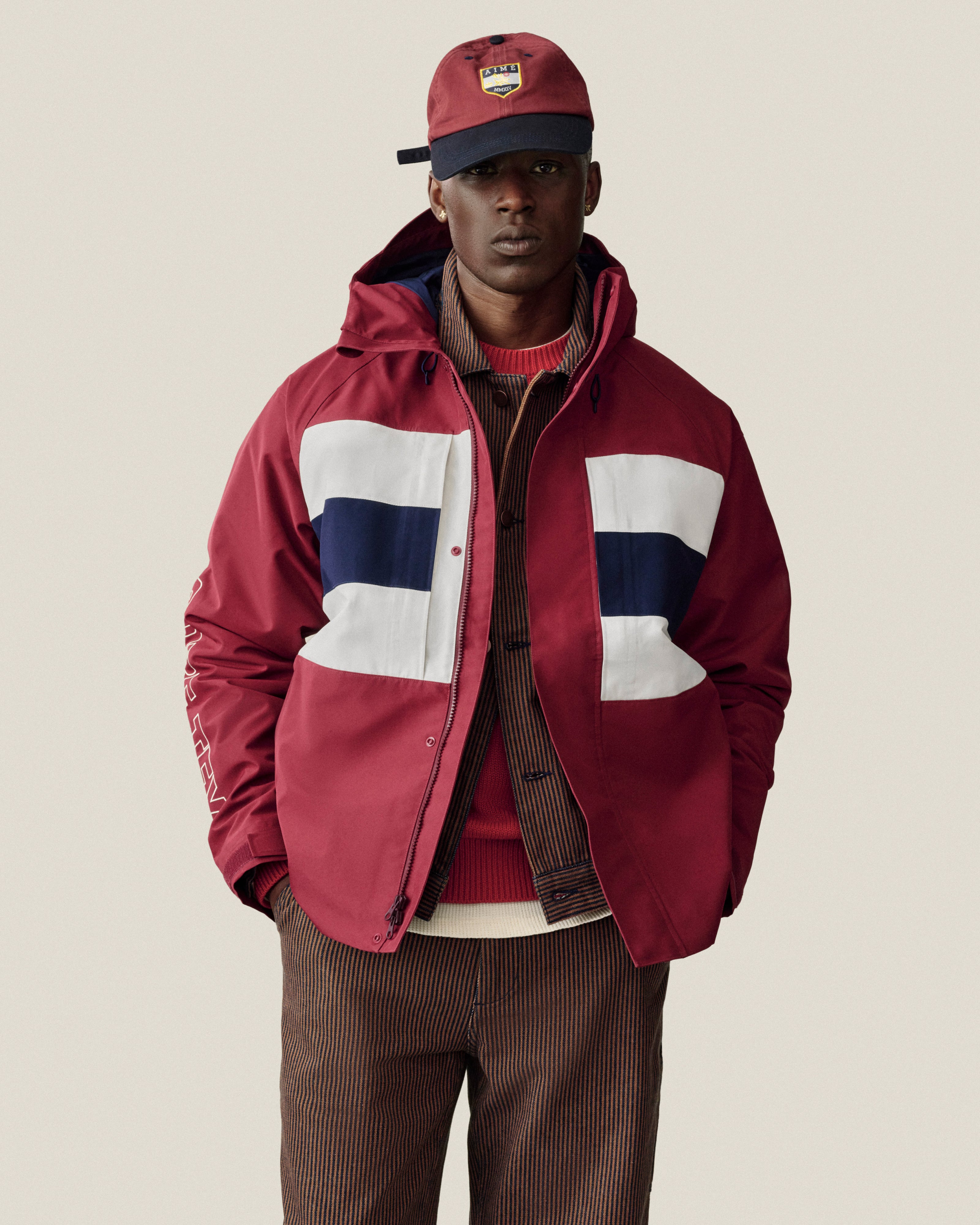 I can’t ID this person, but I can tell you about their GORE-TEX Striped Sailing Jacket or fashion style if you’d like.