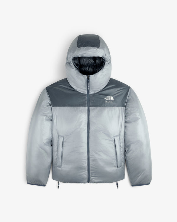 Gray ALD / The North Face Reversible Pertex® Nuptse Jacket with hood, front zipper, and side pockets on white background.