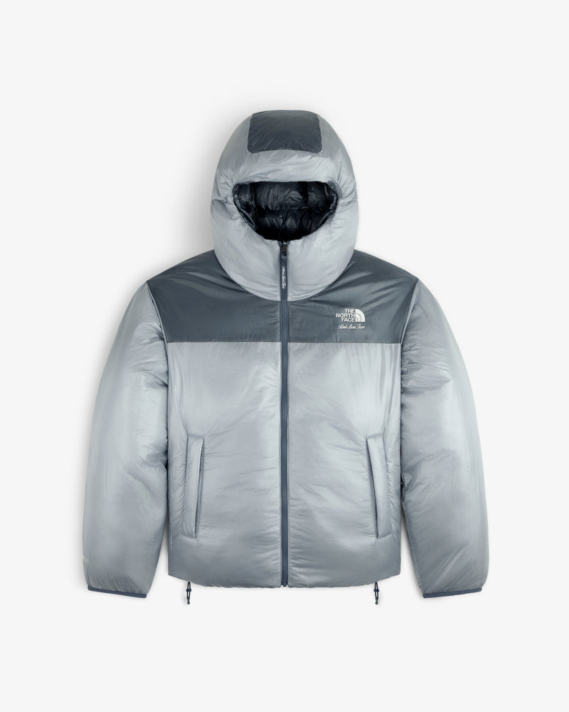 Gray ALD / The North Face Reversible Pertex® Nuptse Jacket with hood, front zipper, and side pockets on white background.