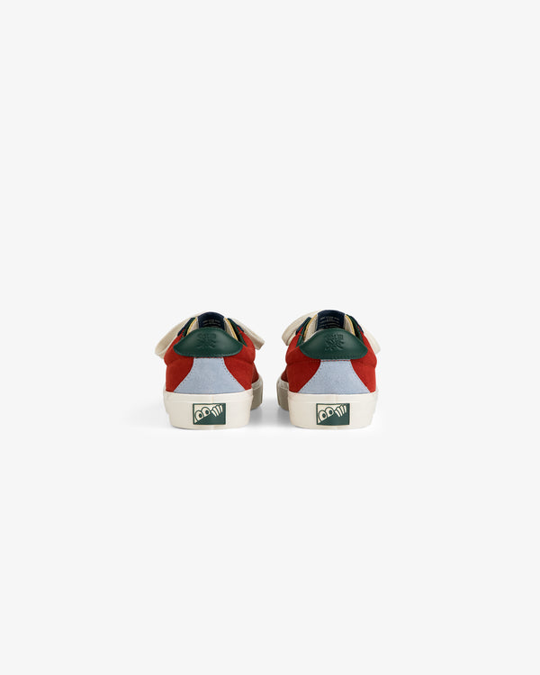 Back view of ALD / Last Resort AB VM001-LO Suede sneakers with red, green, and white panels and heel logo, on white.