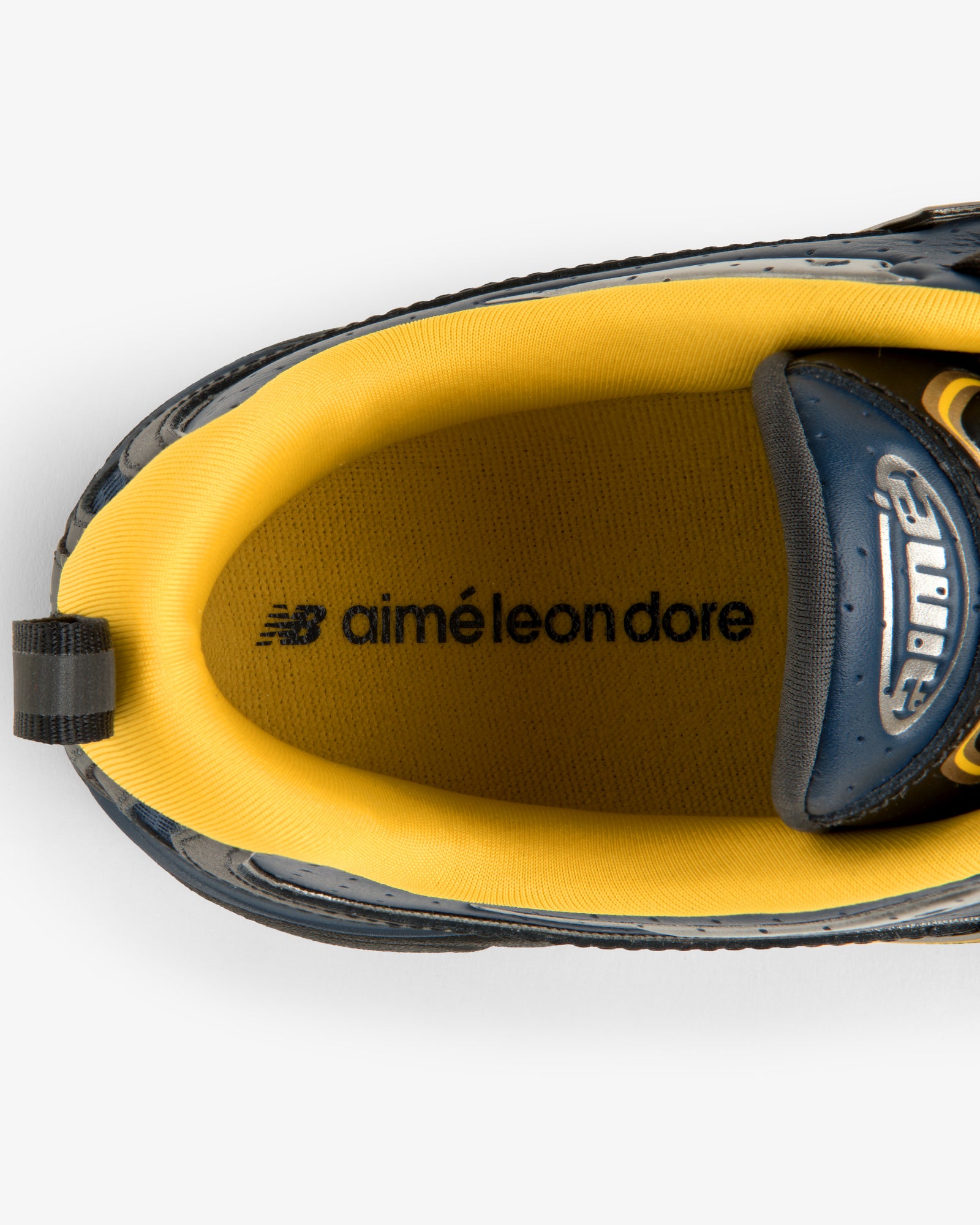 Top view of ALD / New Balance RC56 sneaker with yellow lining and co-branded insole logos.