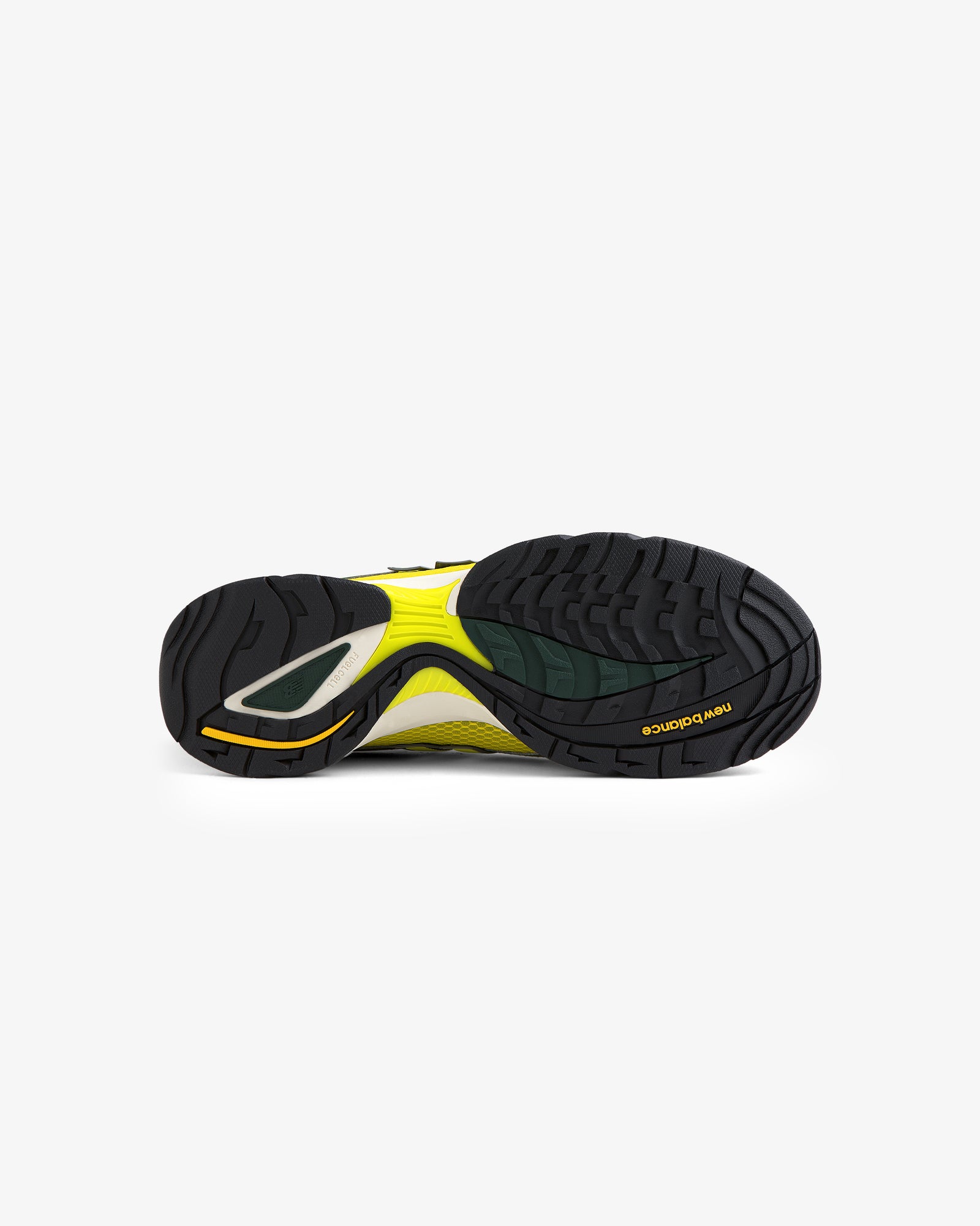 The image shows the black and yellow treaded sole of an ALD / New Balance RC56 shoe against a white background.