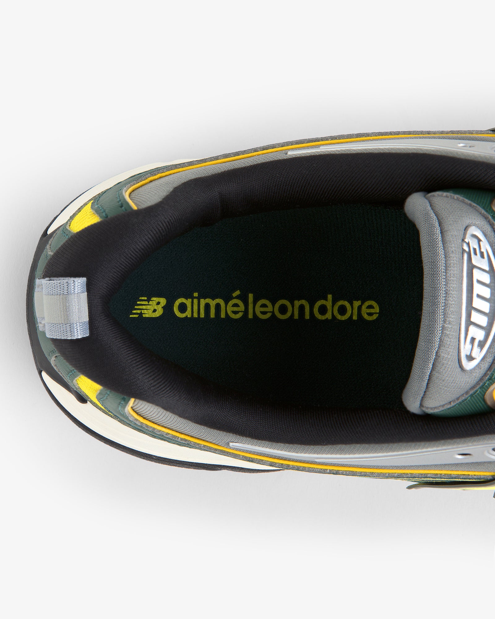 Top view of the ALD / New Balance RC56 sneaker with logos printed inside on the insole.