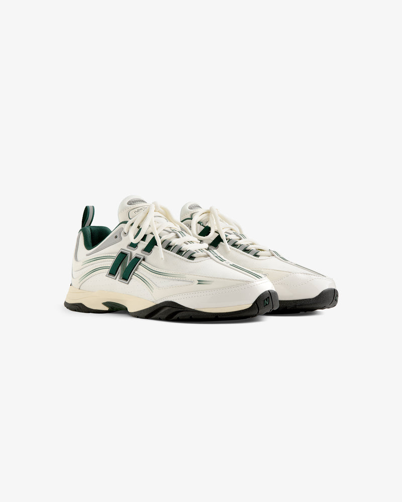 ALD / New Balance RC56 sneakers in white and green with chunky soles, shown at an angle on a white background.