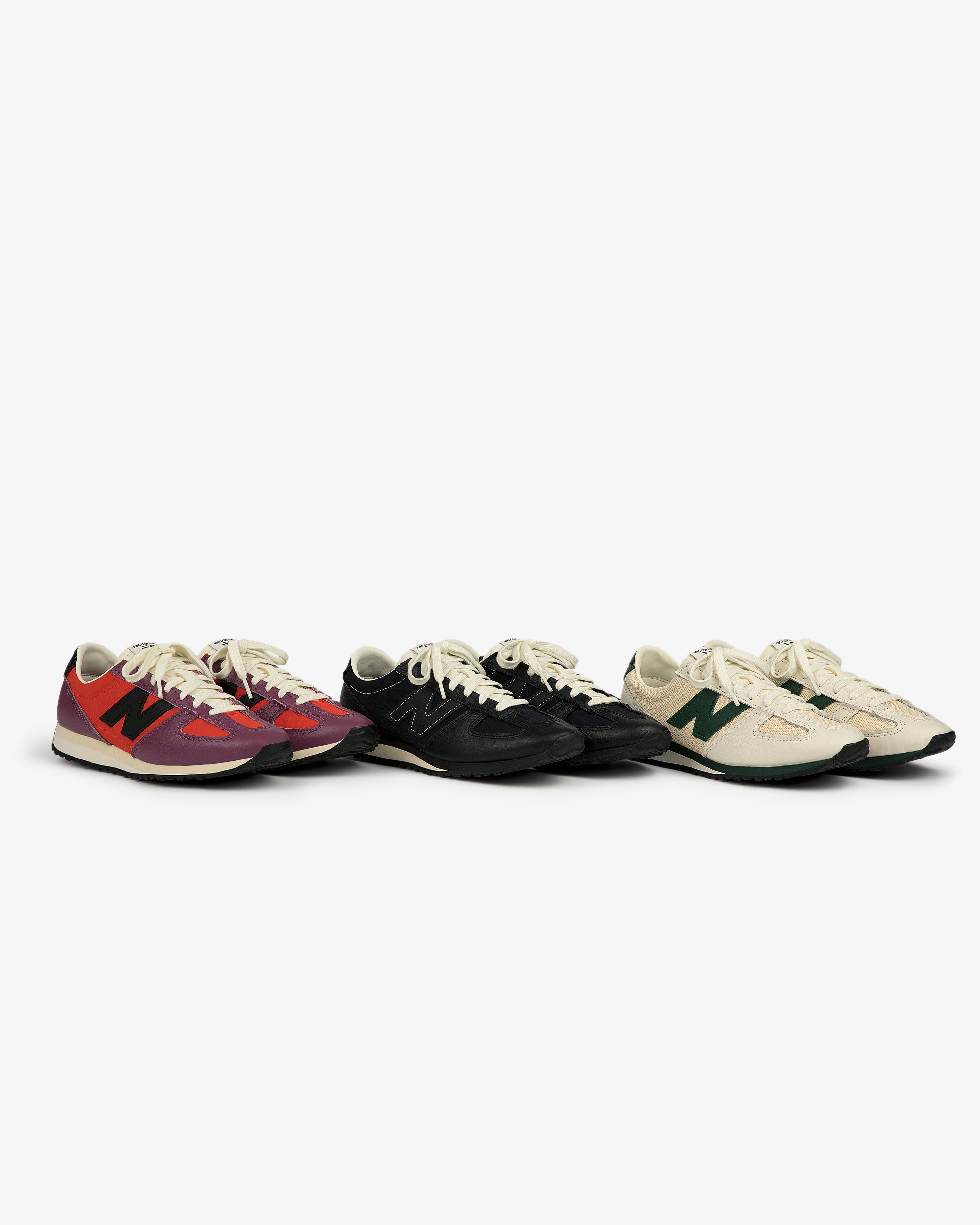 Three pairs of ALD / New Balance 471 sneakers in red, black, and cream, side by side on a white background.