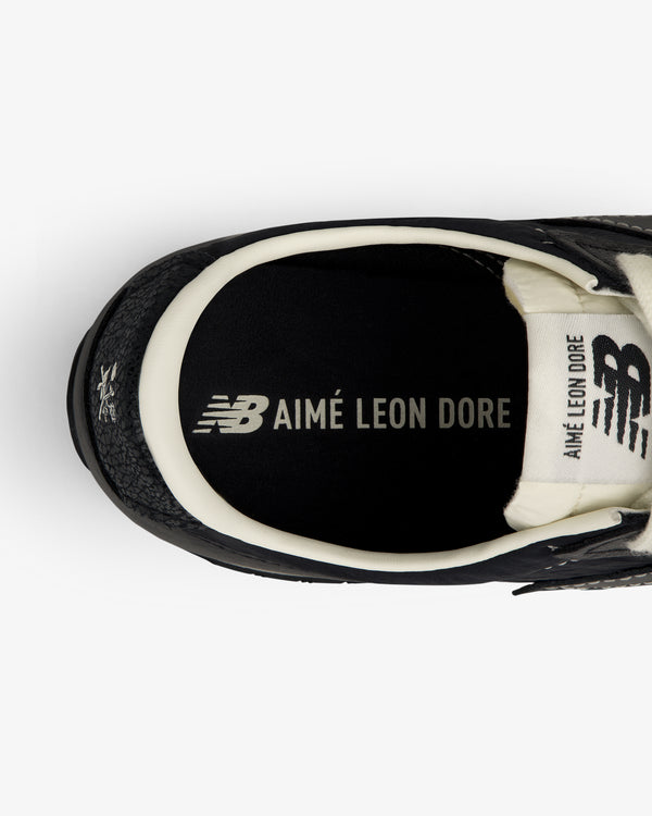 Top view of a black ALD / New Balance 471 sneaker with AIMÉ LEON DORE branding on the insole.