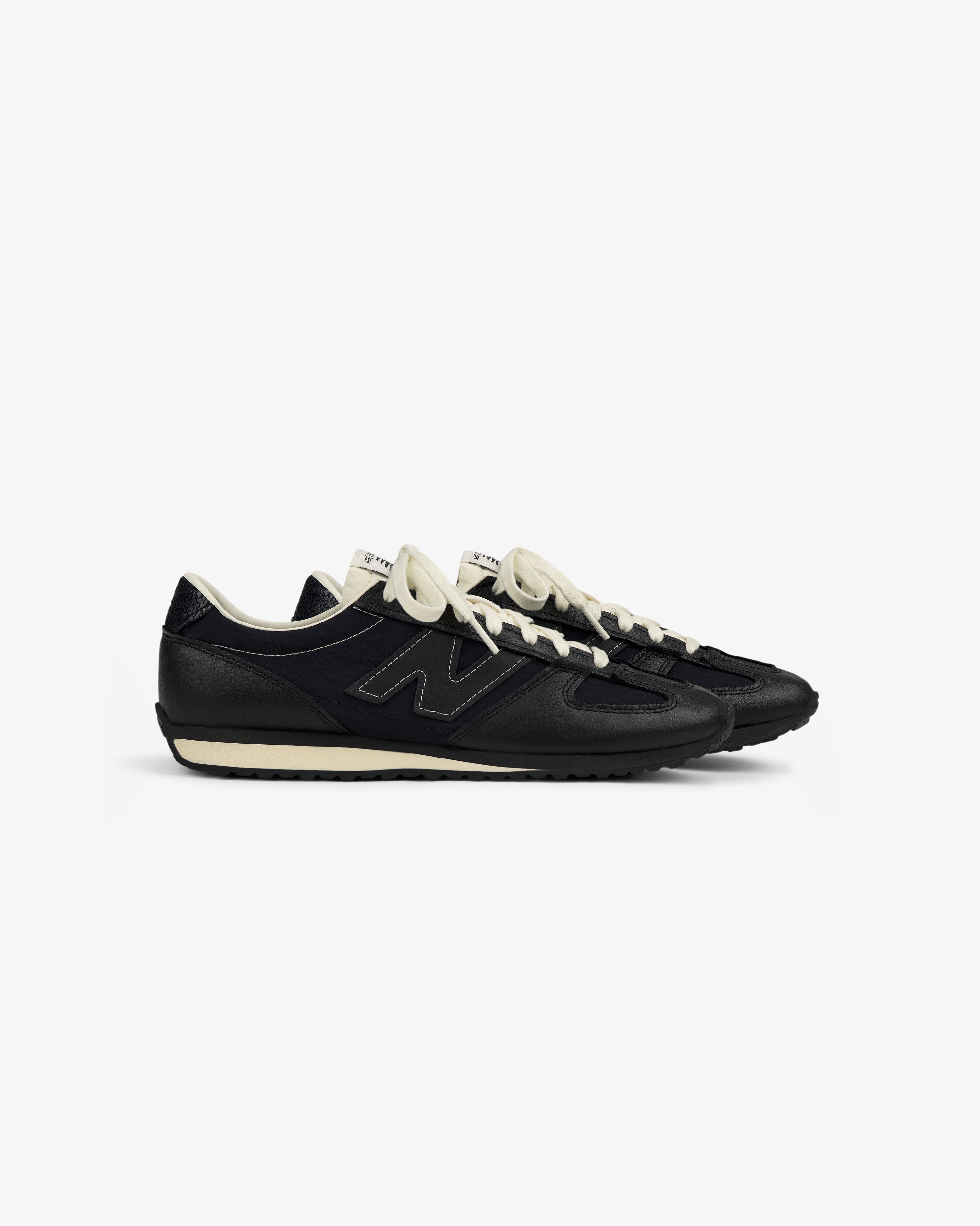 ALD / New Balance 471 in black and white with white laces, side view on a plain white background.